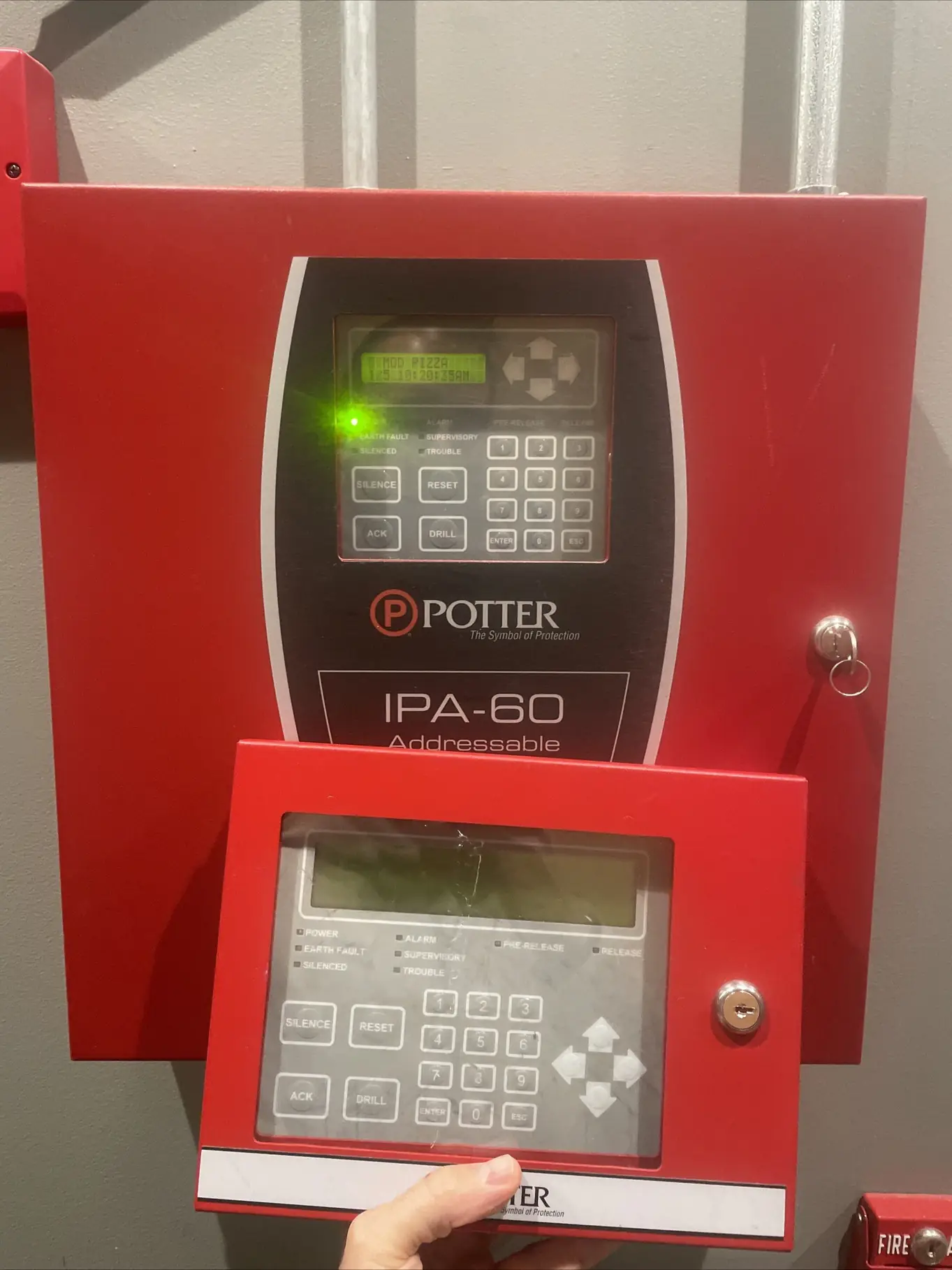 Potter IPA-60 addressable fire alarm control panel with a remote annunciator